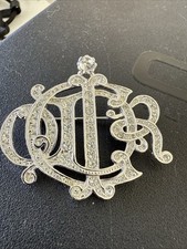 Spilla firmata icona strass