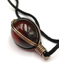 CIONDOLO  OVALE GABBIA ARGENTATA  IN STILE ETNICO