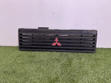 GRIGLIA PARAURTI ANTERIORE MITSUBISHI PAJERO L04 MB383527-30
