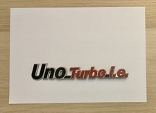 Fregio Scritta Fiat Uno Turbo IE 7653251 ORIGINALE