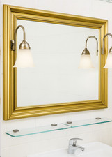 Specchio bagno con cornice dorata e applique integrate