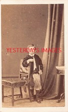 Boy Holding Toy Rifle Kilted