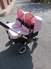 trio gemellare bugaboo con due cappotte rosa e due blu completo di accessori 