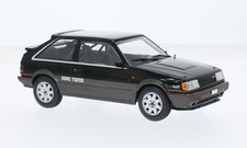 WHITEBOX WB124222 MAZDA 323 4WD TURBO BLACK/MET.DARK GREY 1:24 Modellino