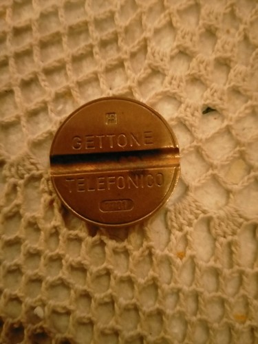 Gettone telefonico 7701 ipm - telefonico,