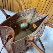 borsa versace marrone con fantasia medusa ottime condizioni mai usata .