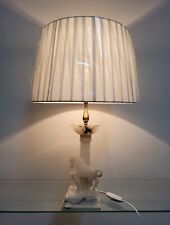 Lampada con base in pietra bianca(cavallo) componenti in ottone paralume tessuto