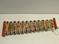 vecchio XILOFONO PERSONAGGI DEL CIRCO per bambini in legno e latta vintage di