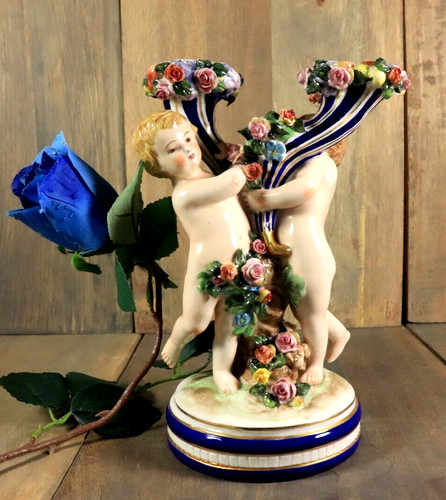 Antico candelabro porcellana