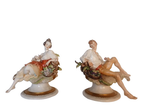 Coppia statuina in - di,