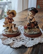 Statuette soprammobili in resina , apri ostriche, vetrinetta the tisane