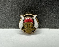 Antica spilla da bavero faccia