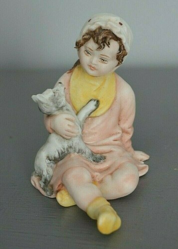 Figurine fillette son chien - et,