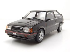 Modellino auto Mazda 323 4WD Turbo 1989 nero grigio 1:24 whitebox