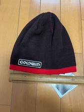 Cappello GOLDWIN reversibile in maglia a righe nero/rosso mai usato