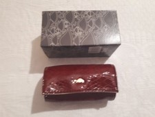 Portagioie Carpisa arrotolato colore bordeaux pelle martellata