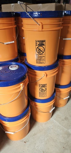 Orange plastic water barrel - plastic,