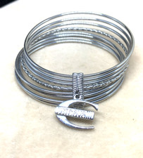 BRACCIALE RIGIDO JUST CAVALLI IN ACCIAIO  7 CERCHI E PENDENTE