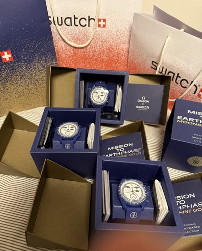Swatch omega mission - swatch,