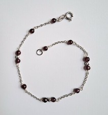 Bracciale in argento 925 con sfere di argento sfaccettate e granato rosso