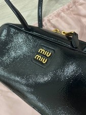MIU MIU Beau manico superiore