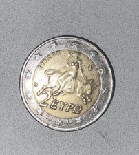 Moneta rara errore di conio sul 2 e Centraggio da 2 euro Grecia anno 2002.