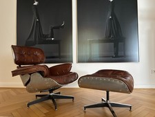 Nuova Eames Lounge Chair, pelle marrone, rivestimento in alluminio, incl. ottomano