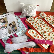 Kit per 8 Confezioni Coccole Bambola Portabebè Ergo Cani Fragole