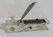 24675 Fermacarte in plastica con calendario perpetuo a forma di molletta