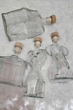 Lotto 4 bottiglie particolari di vetro, da 200 ml con varie forme.