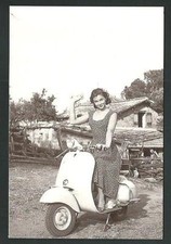 Lorella De Luca on Vespa