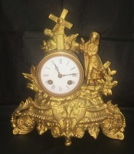 Pendulette en régule redorée