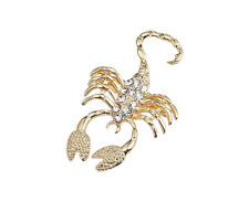 Spilla gioiello segno zodiacale scorpione in acciaio dorato.