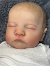 Bambola neonato realistica ragazzo