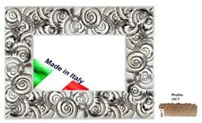 Cornice in legno bianca e