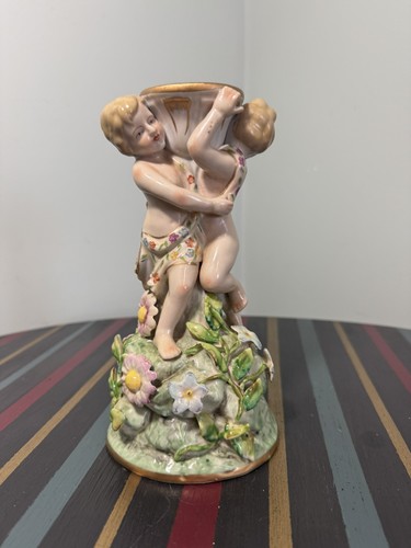 Antica statuina putti
