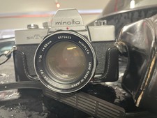 Fotocamera 35 mm Minolta SRT 101  con obiettivo