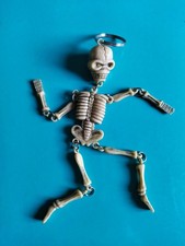 Portachiavi "Scheletro", vintage, plastica, colore avorio, altezza 14 cm.