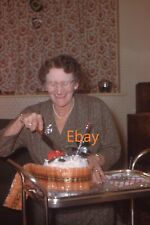 35mm Slide - Elegant Older Smiling Woman Cutting Christmas Cake On Trolley, 1960