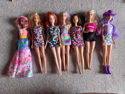 Sette bambole barbie varie - sette,