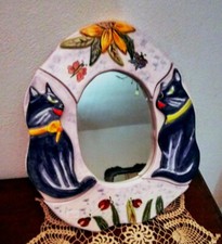 Cornice con specchio ovale