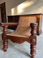 Sedia di Piantagione,Anglo-Indiana.In Teak intarsiata,con braccioli estensibili.