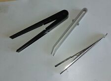 Pinzette per sviluppo fotografie in camera oscura. Blocco di tre pezzi