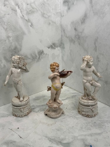 Tris putti decorativi in - tris,