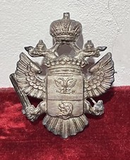 Spilla in metallo con stemma