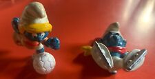 Set 4 Puffi Sportivi (corridore, puffetta calciatrice, pattini, surf). Anni 80