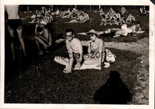1958 Couple sunbathing In