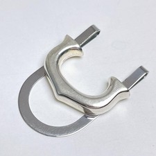 Fermasoldi Cartier motivo C de