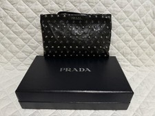 Borchie da polso Prada