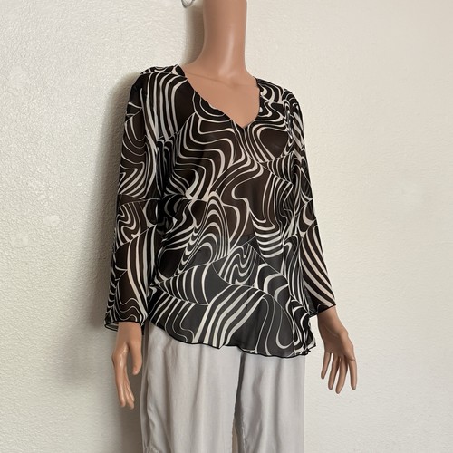 Blusa asimmetrica trasparente